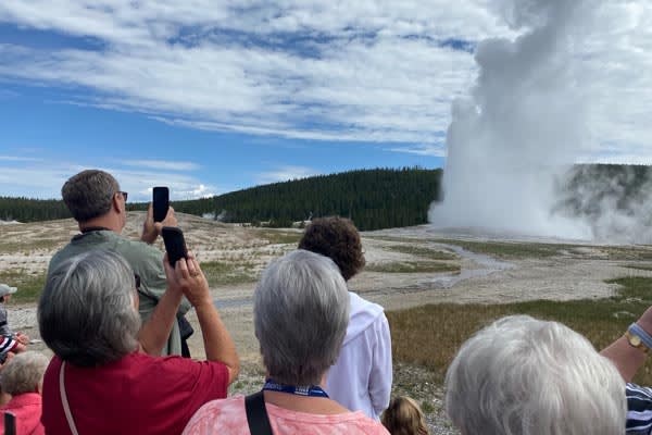 YMT Guests at Old Failthful Geyser Rocky Mountains Tour 